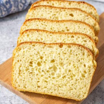 Slices of homemade bread on a wooden board.