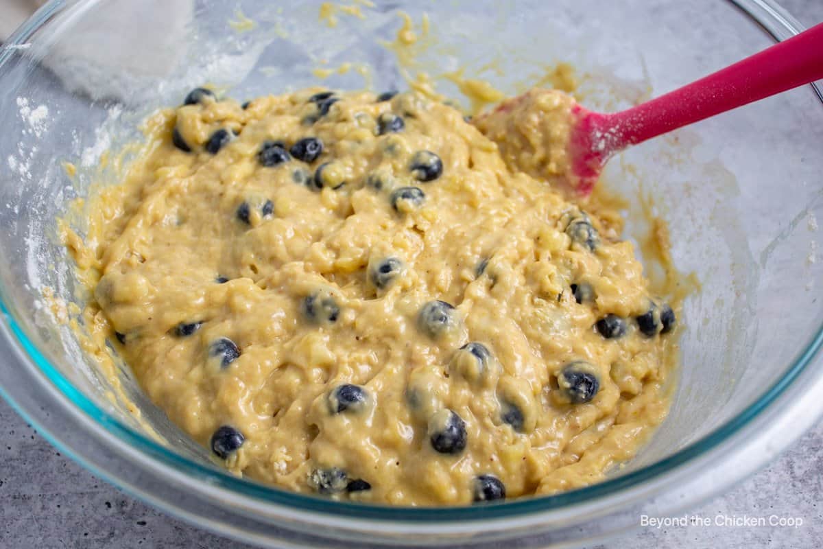 Muffin batter with blueberries.