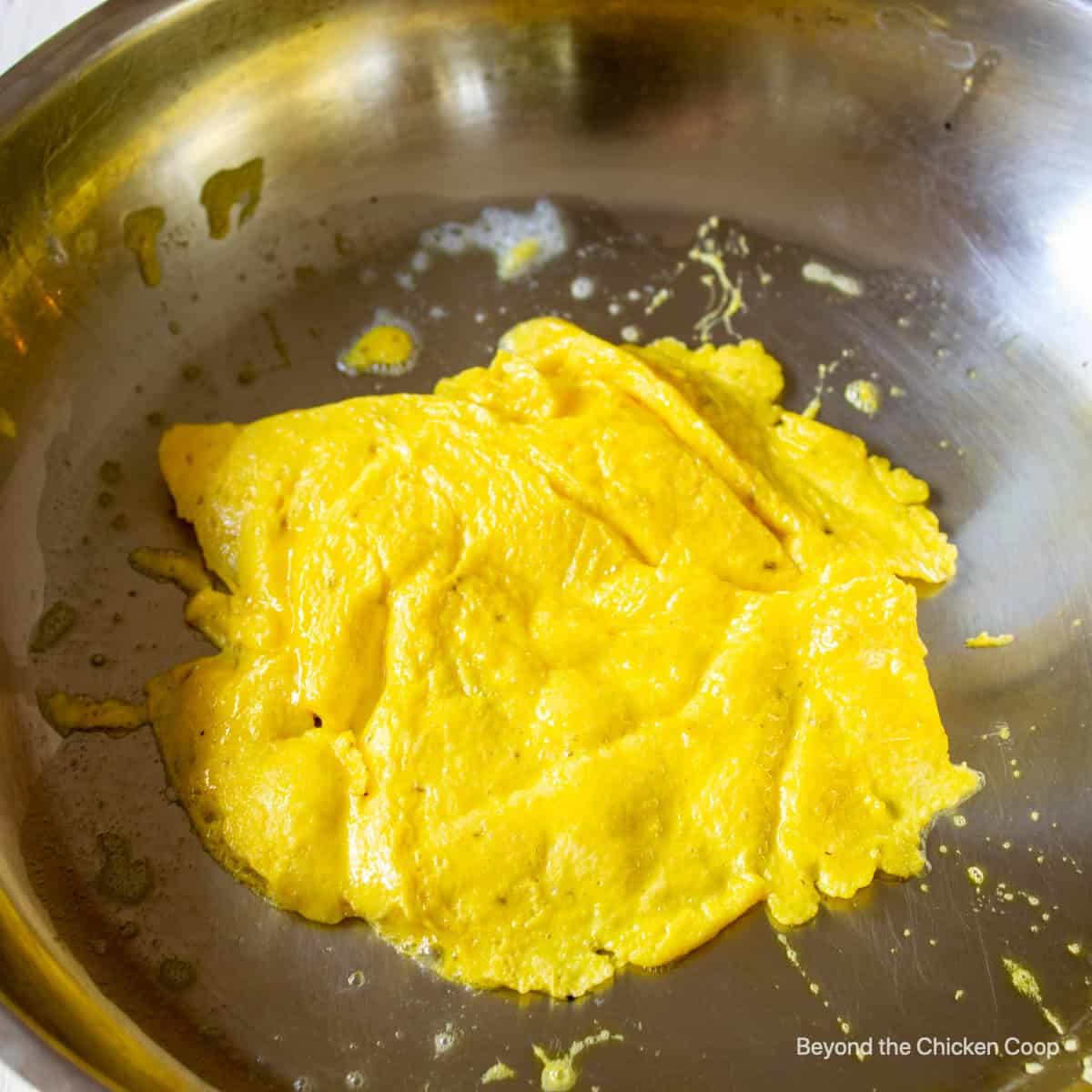 Cooking a scrambled egg.