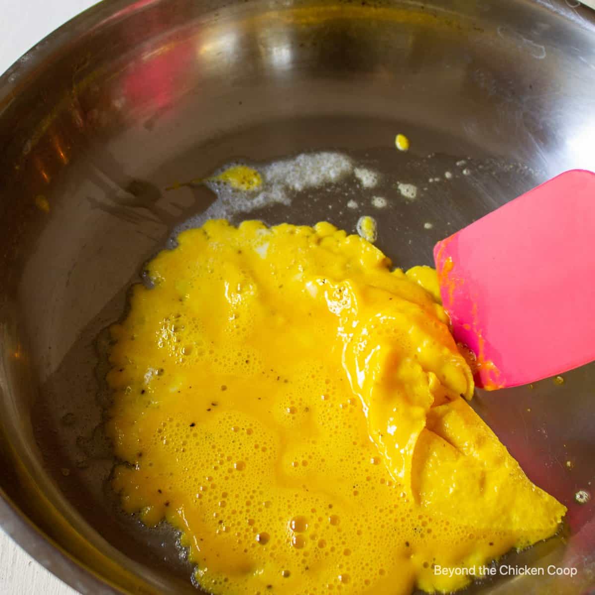 Cooking a scrambled egg.