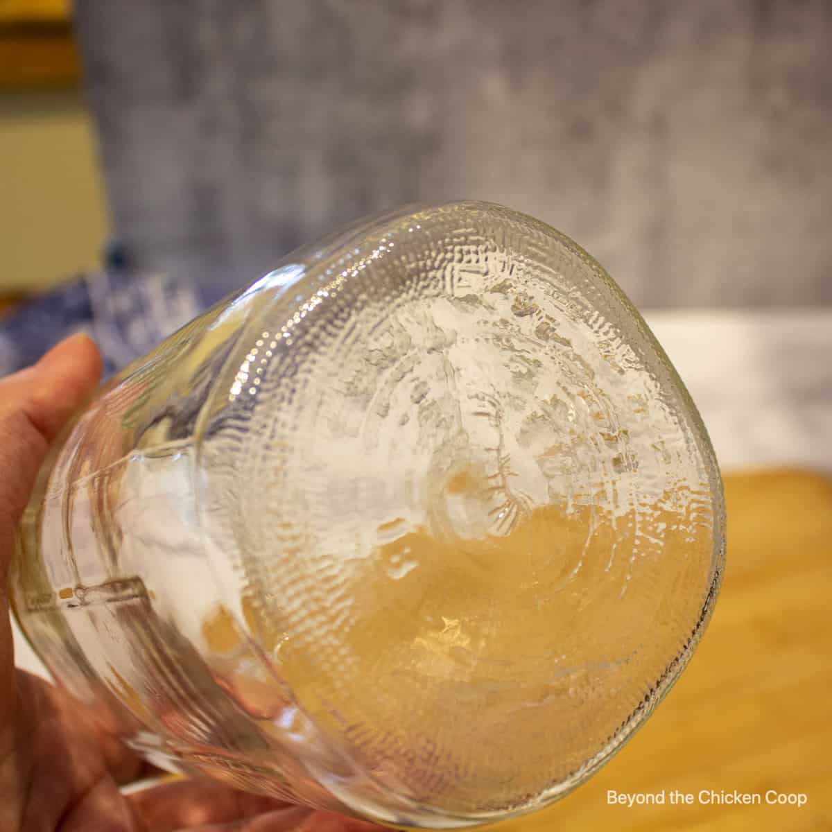 A canning jar with a hairline crack. 