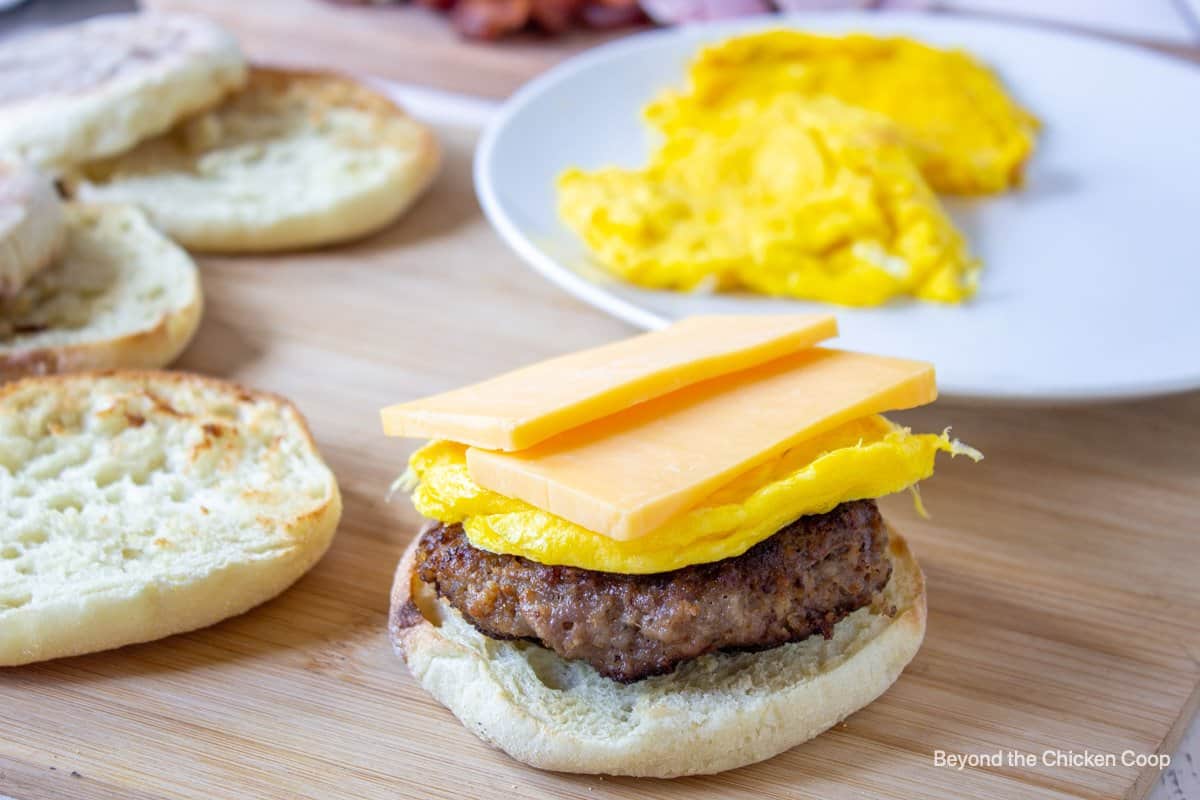 Assembling a breakfast sandwich.