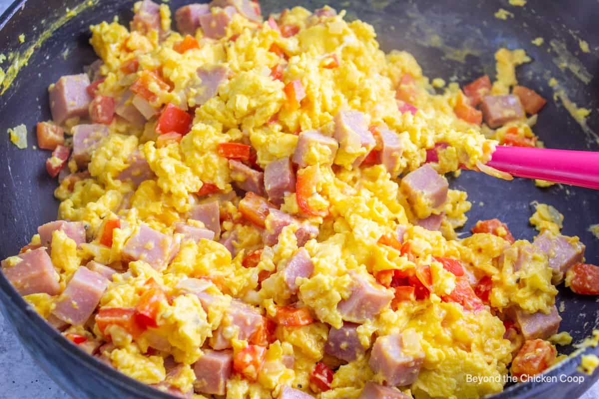Scrambled eggs with ham and peppers. 