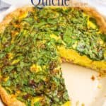 A deep dish quiche topped with spinach.