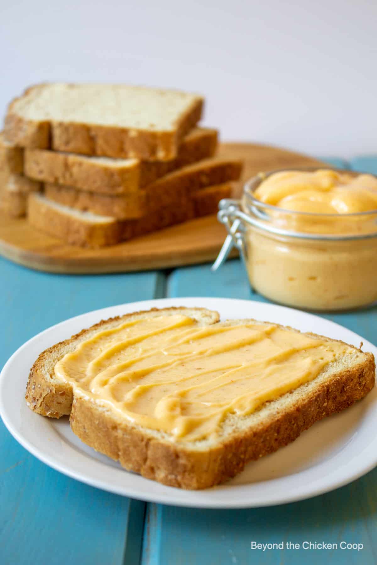 A slice of bread slathered with Miracle Whip.