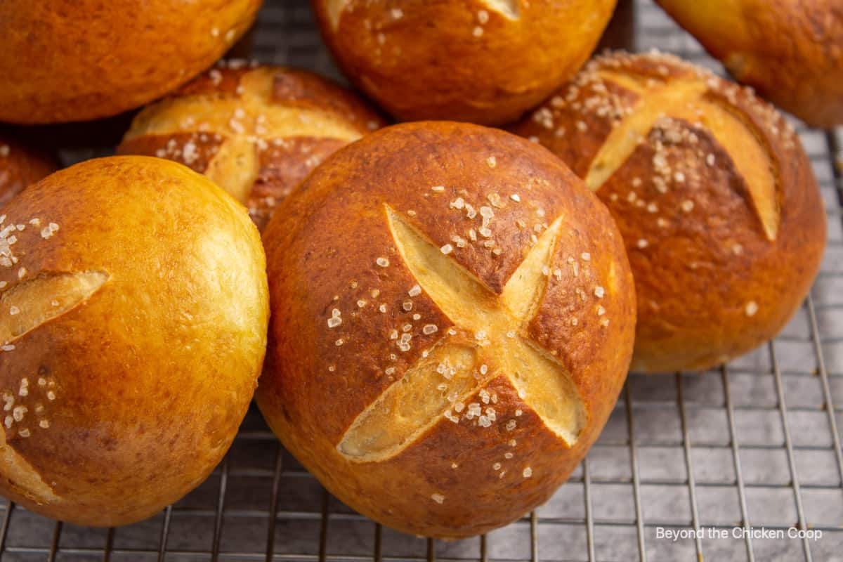 Golden rolls on a baking rack.