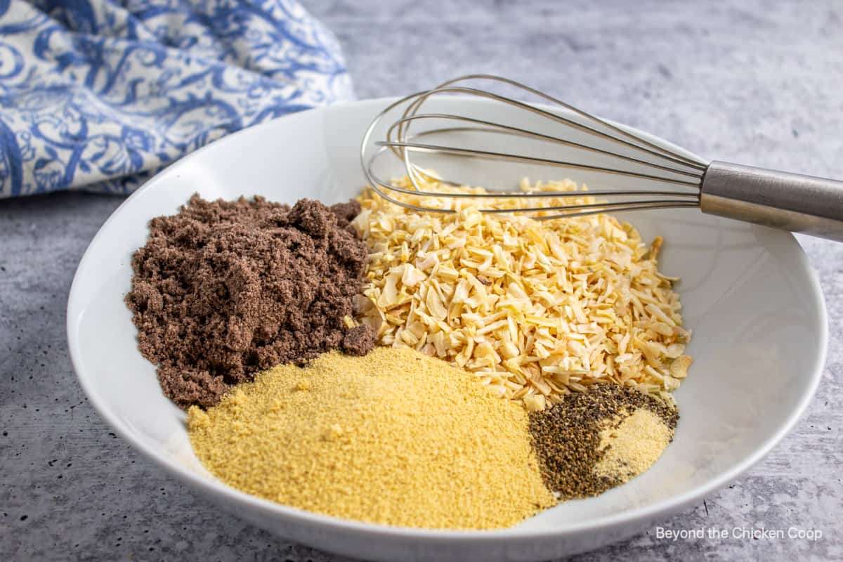 Spices and dried onions in a bowl.