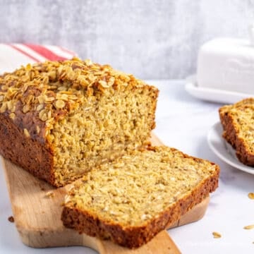 Sliced banana bread on a cutting board.