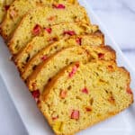 Slices of bread filled with diced rhubarb.