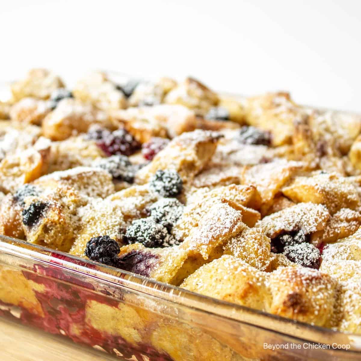 A baked french toast topped with powdered sugar.