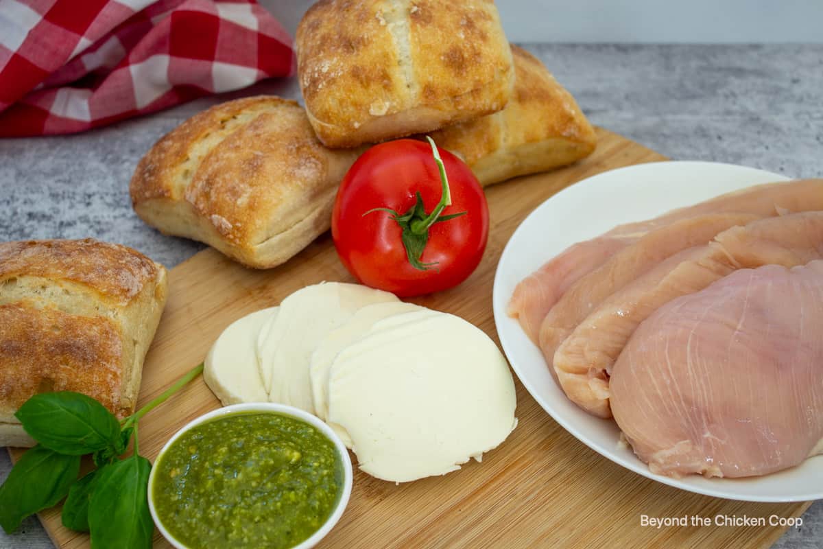 Ingredients for making a chicken sandwich with pesto.