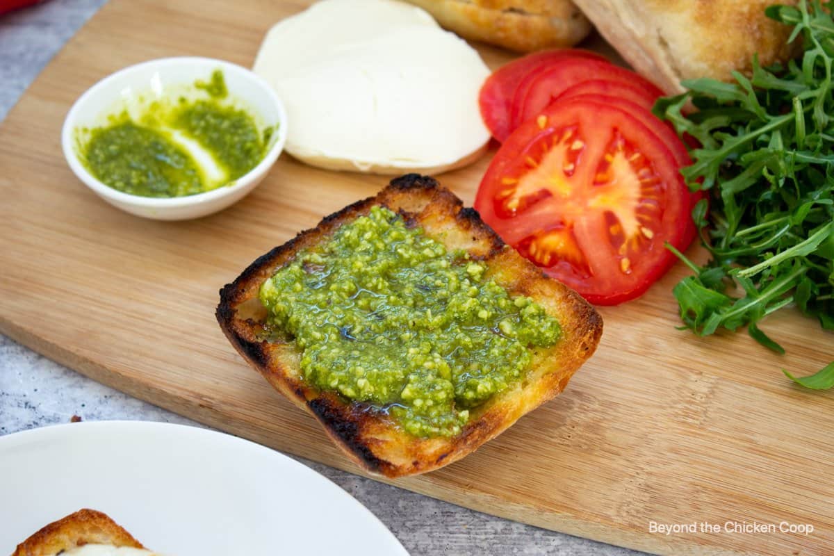 Pesto on a toasted bun.