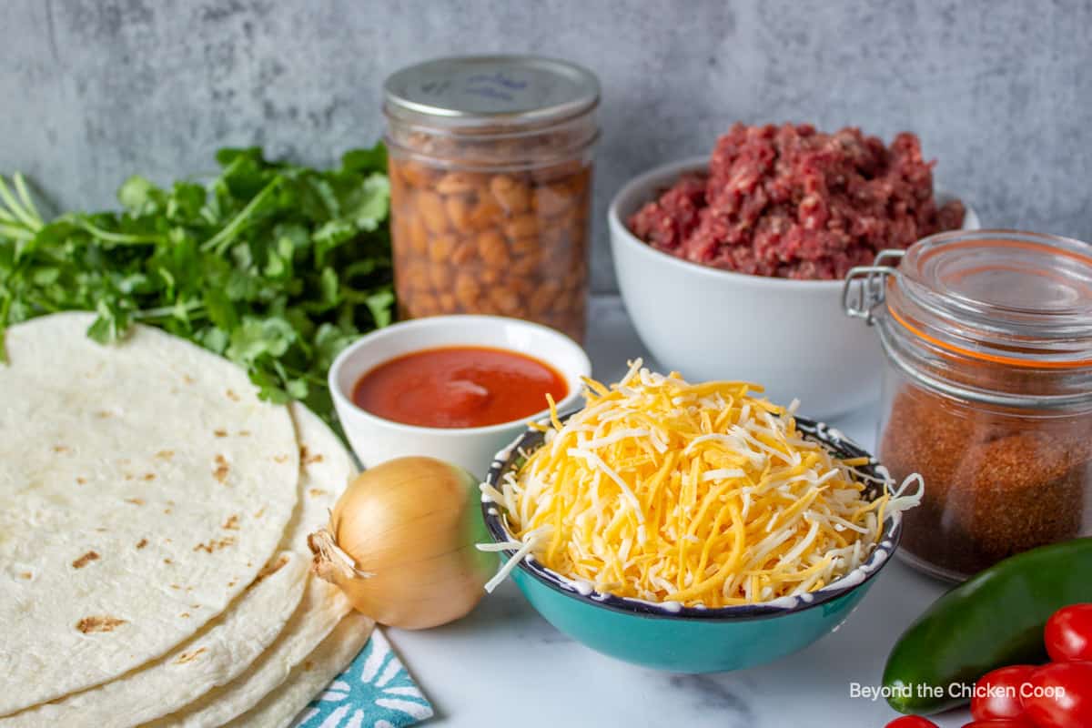 Ingredients for making a beef chimichanga.