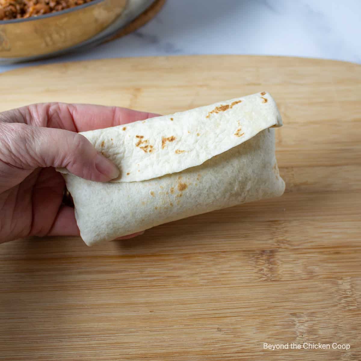 A filled and folded burrito.