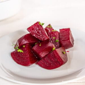 Beets topped with fresh parsley.