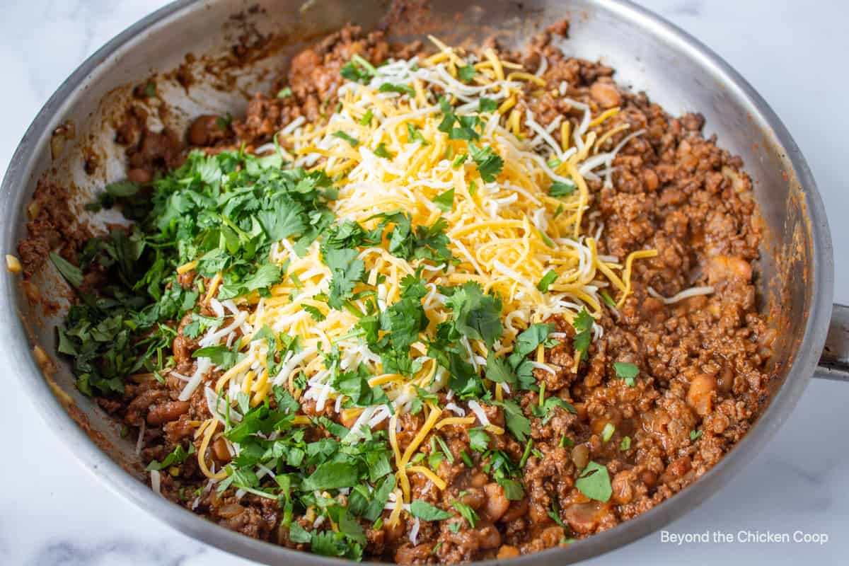 Cheese and fresh cilantro added to ground beef.