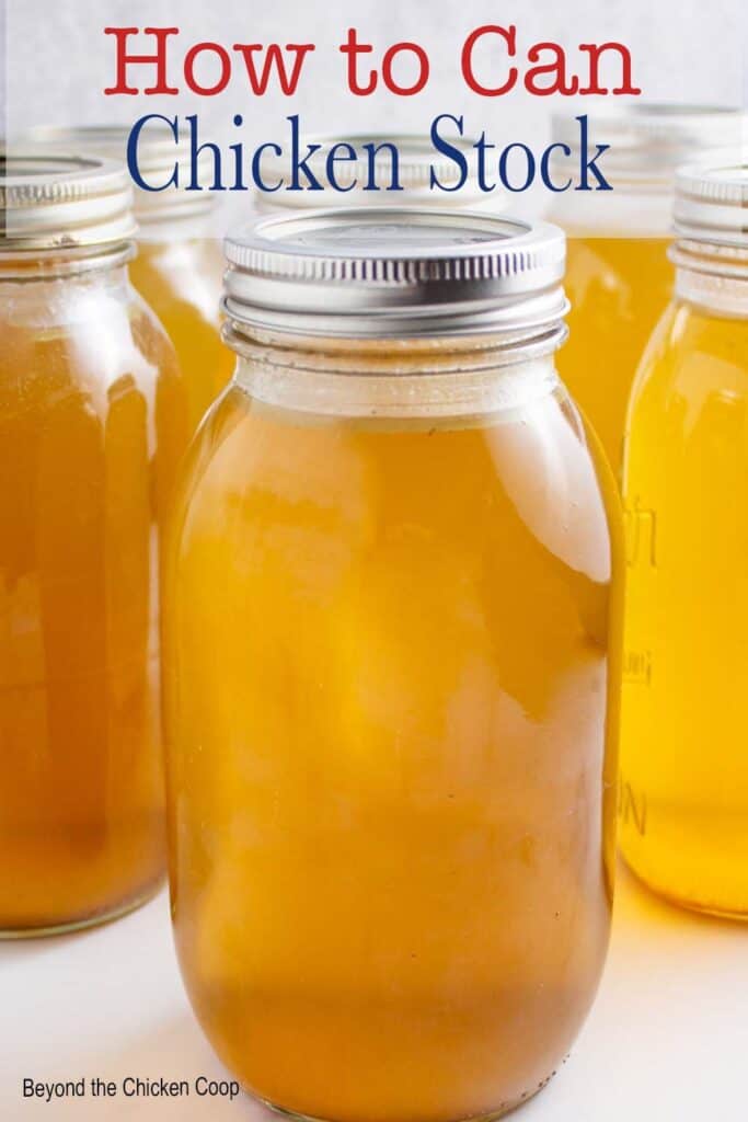 Canning jars filled with chicken stock.