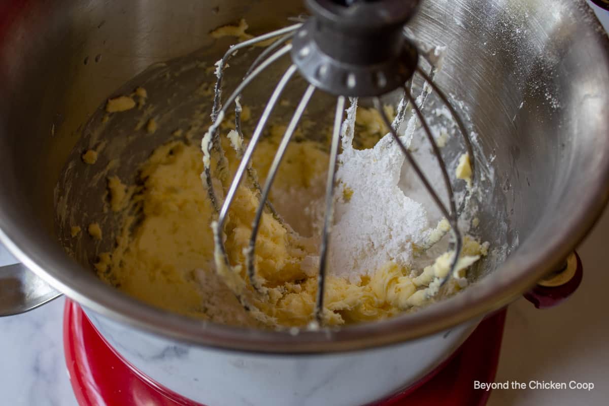 Butter and powdered sugar in a mixing bowl.