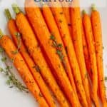 Whole roasted carrots with part of the stems.