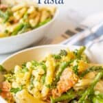 Pasta with fish and green vegetables.