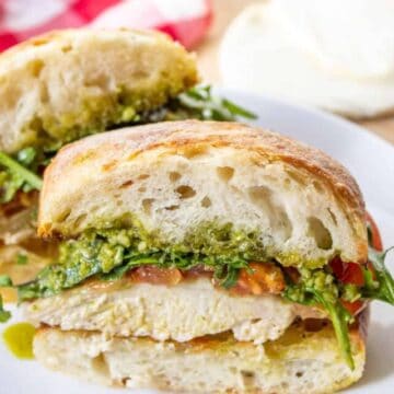 A sandwich with chicken and pesto.