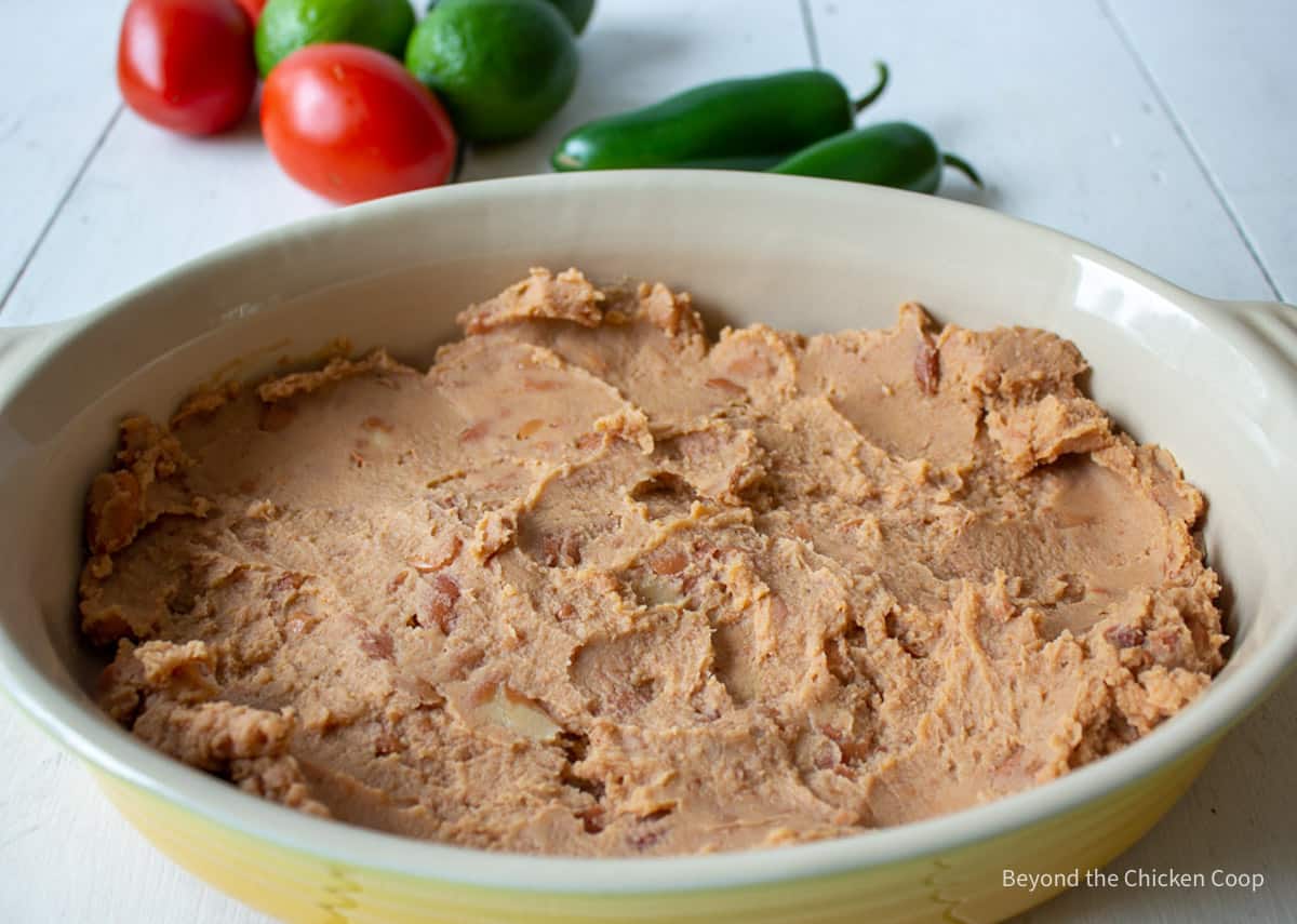 Refried beans in a casserole dish.