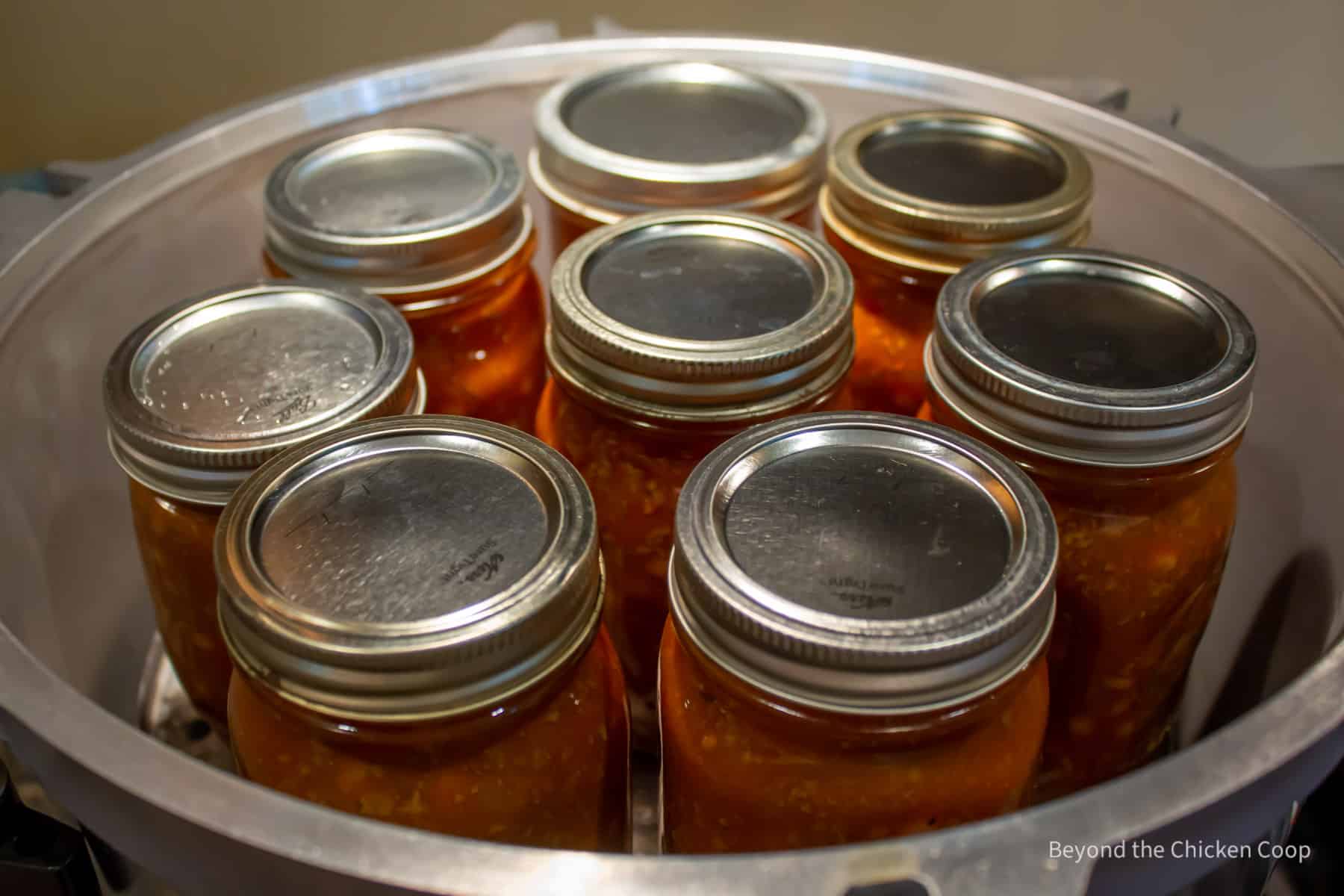 Jars of chili in a pressure canner.