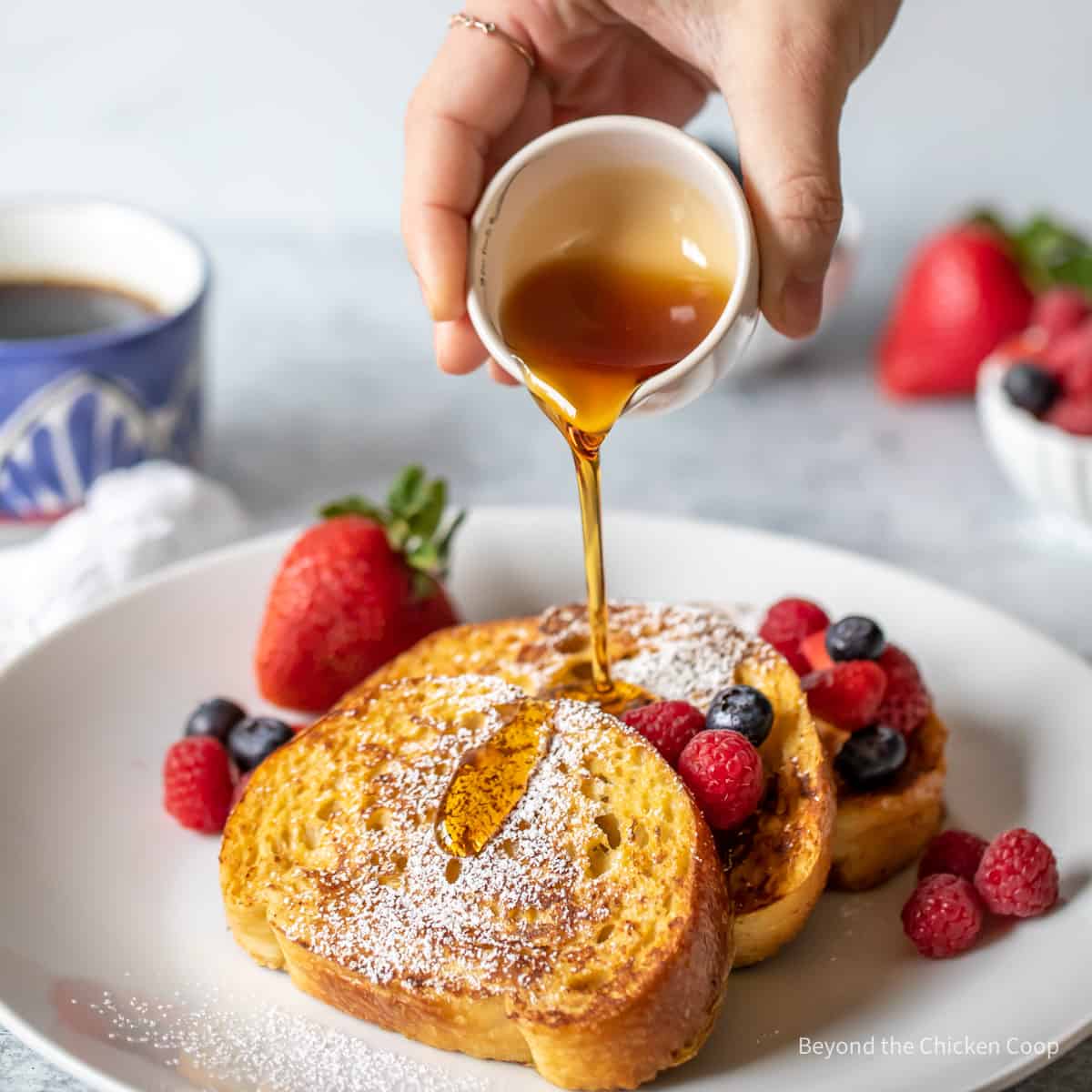 Syrup pouring over breakfast bread.