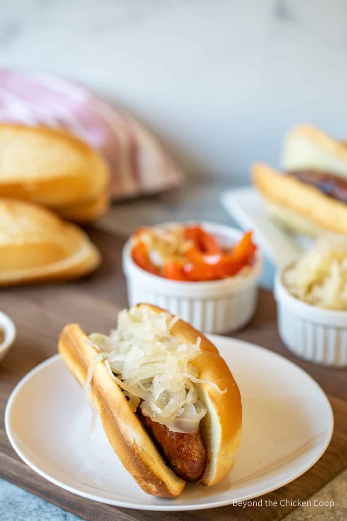 A sausage with sauerkraut.