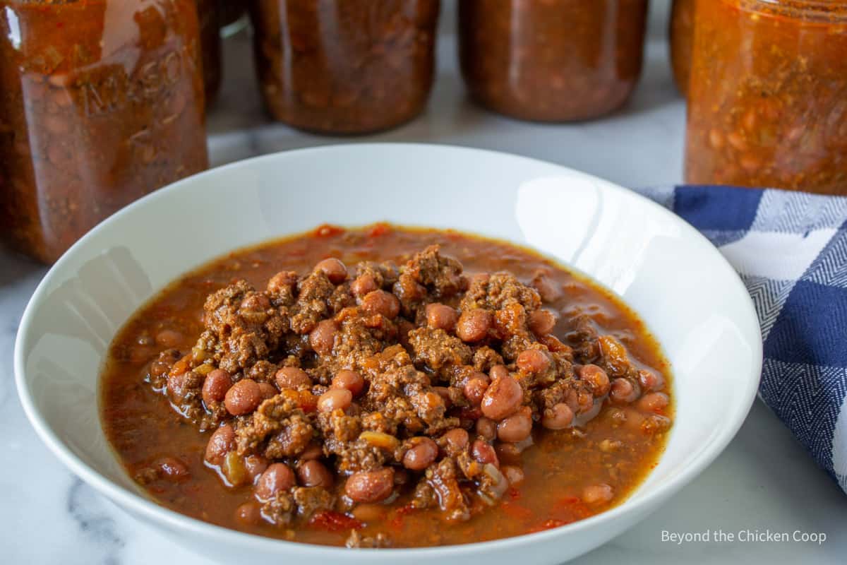 Chili with beans in a white bowl.