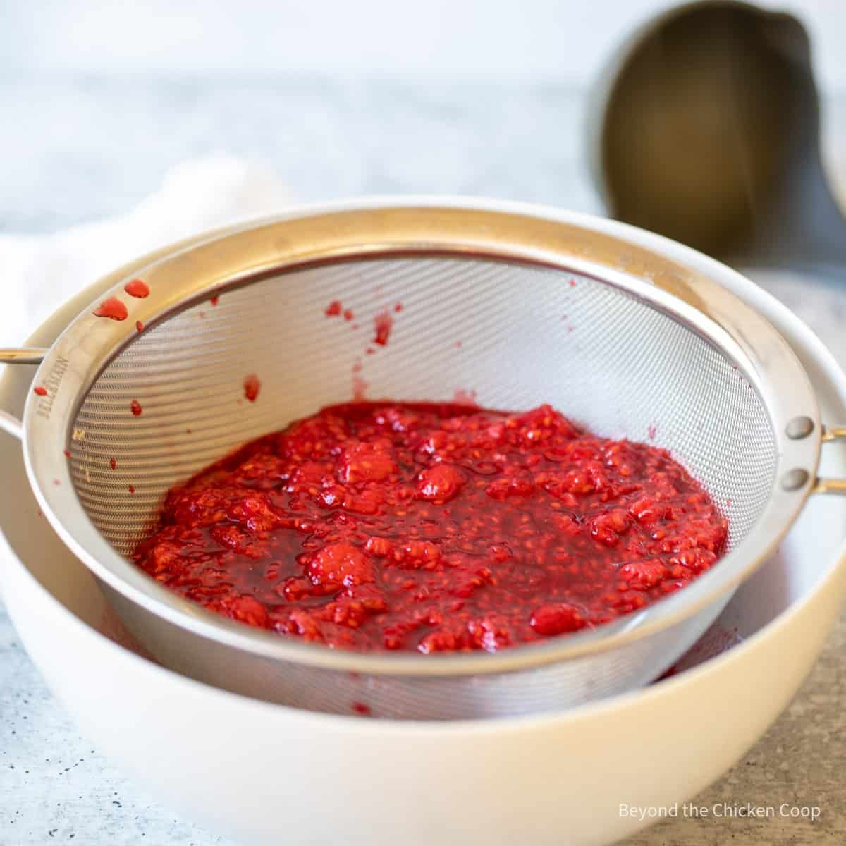 Raspberries in a sieve.