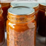 Canning jar filled with chili with beans.