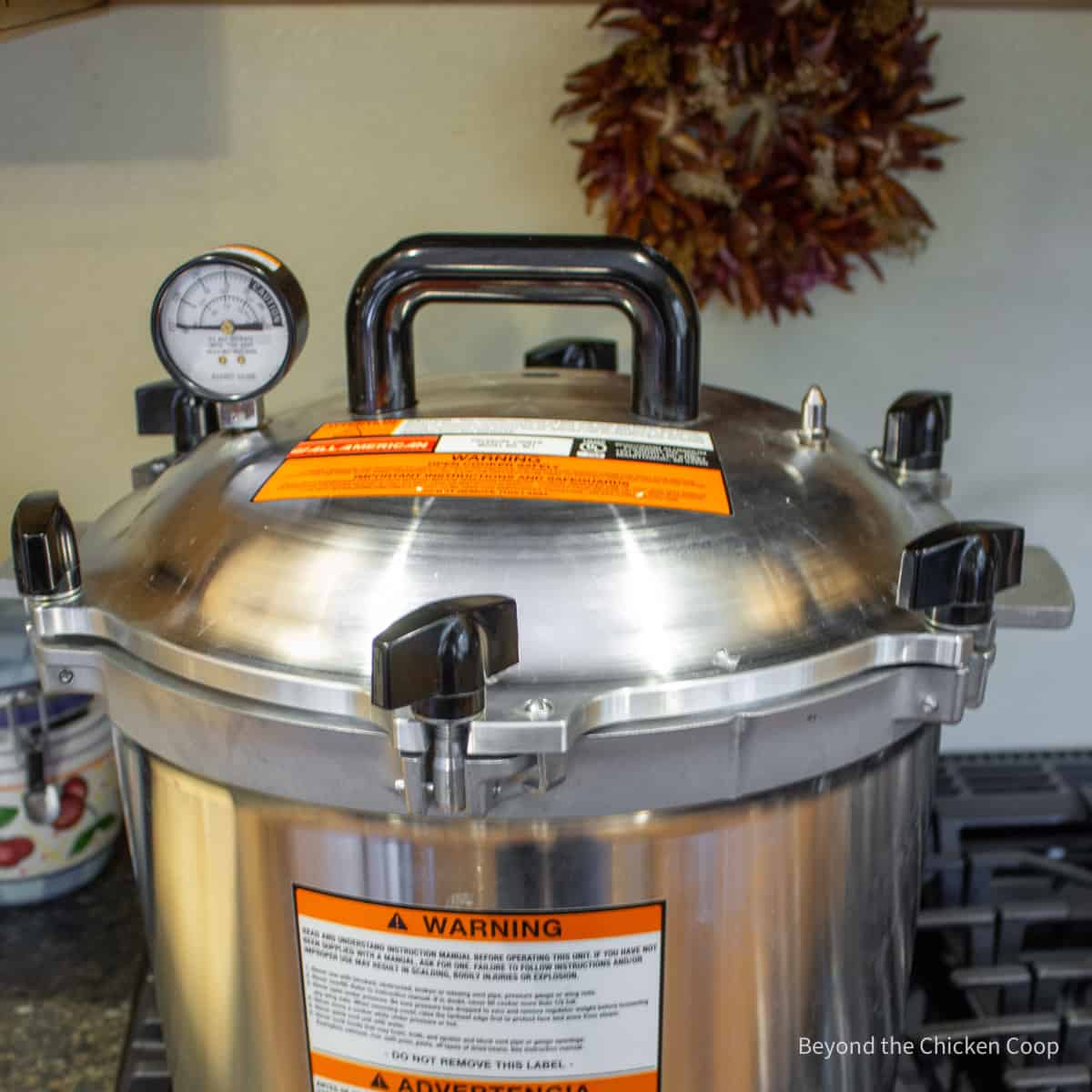 A pressure canner on a stovetop.