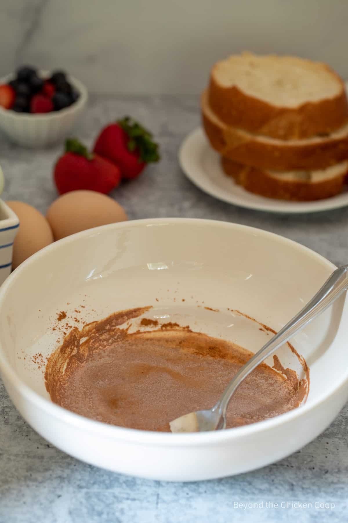 Mixing cinnamon and milk together.