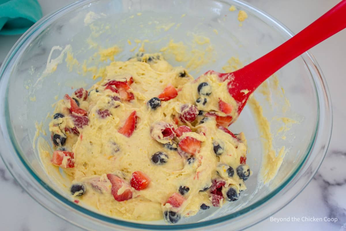 Muffin batter with mixed berries.
