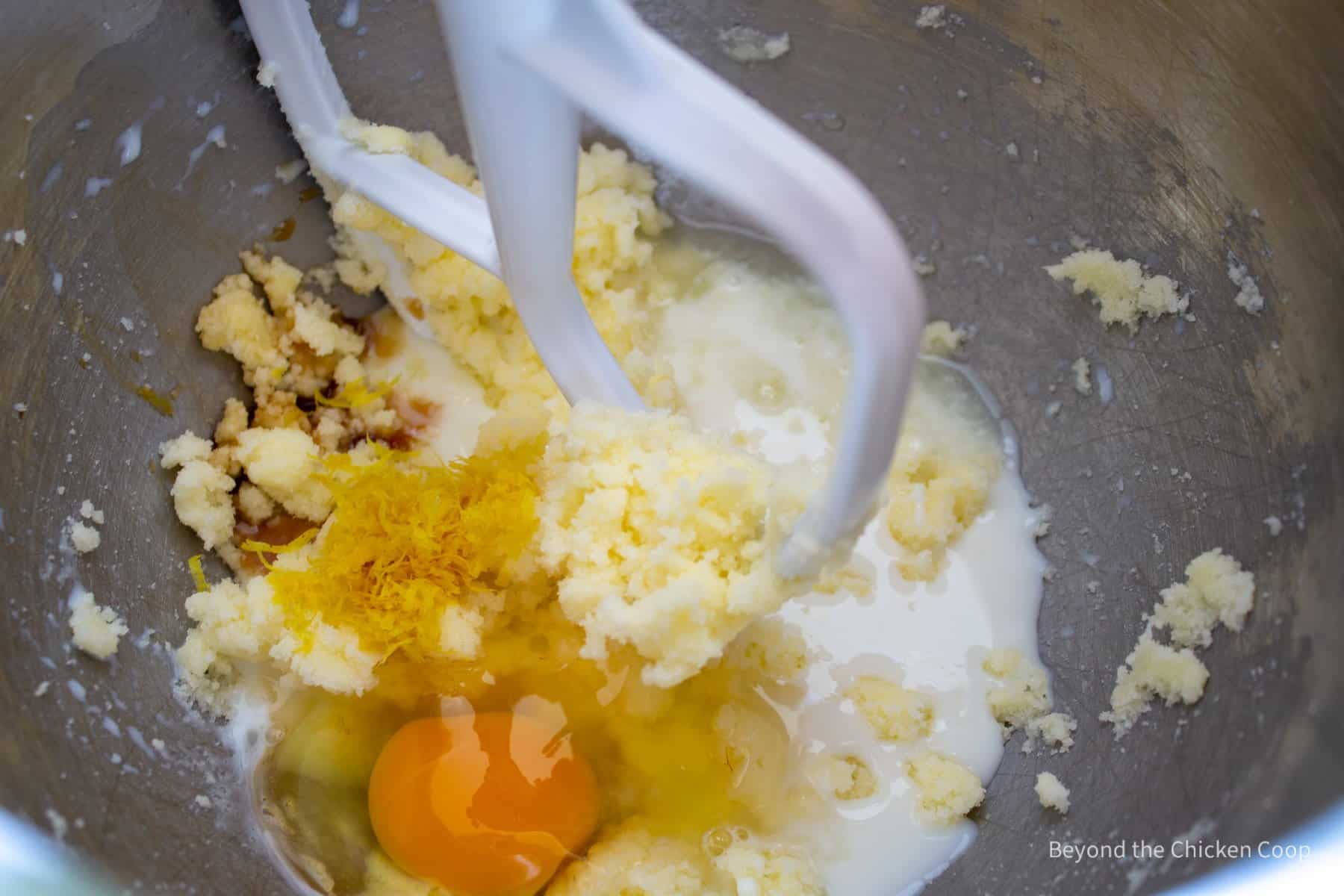 Eggs and milk added to a mixing bowl.