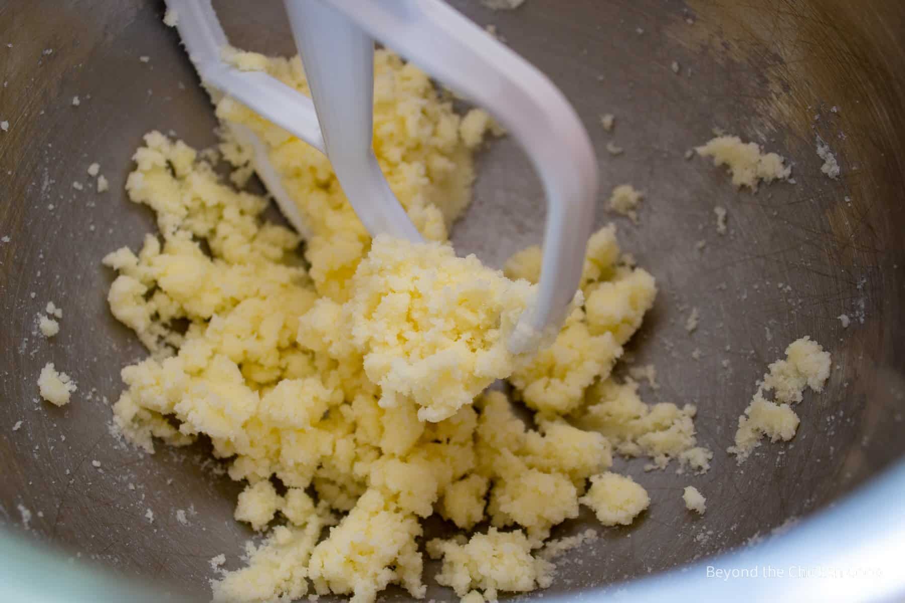 Butter and sugar in a mixing bowl.