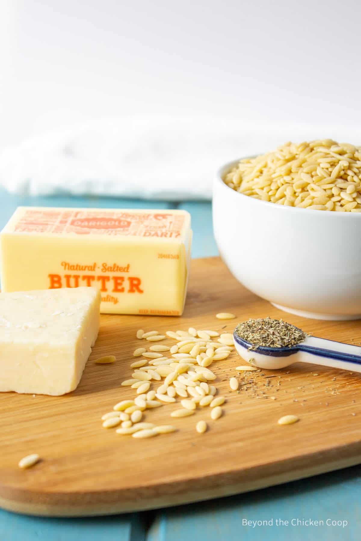 Ingredients for making orzo with butter and herbs.