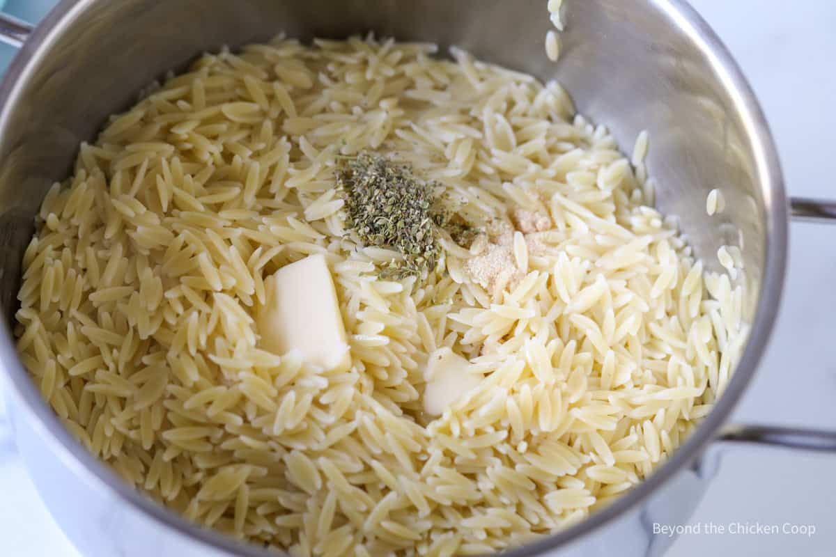 Herbs with orzo and butter.