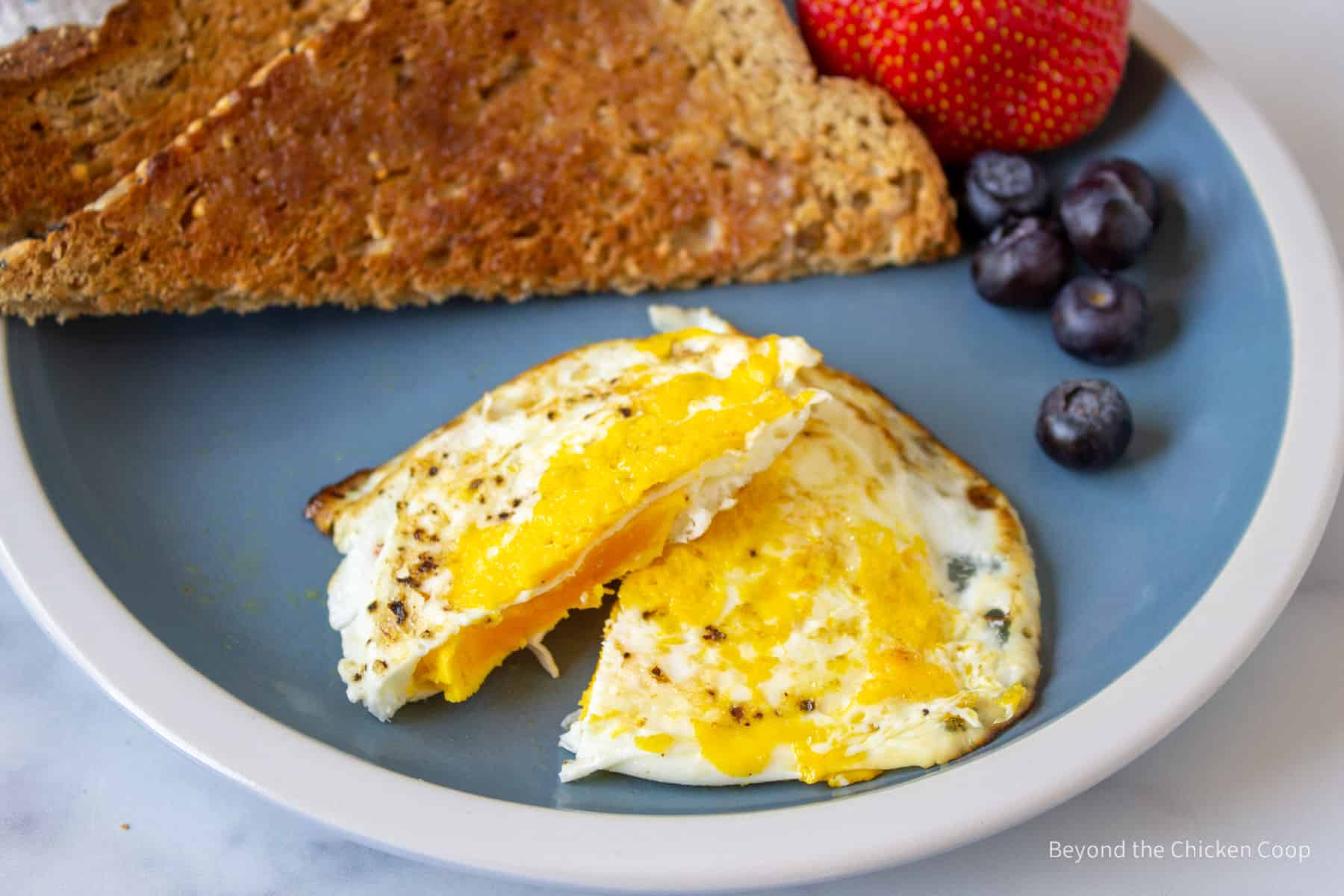 A cooked egg sliced in half. 