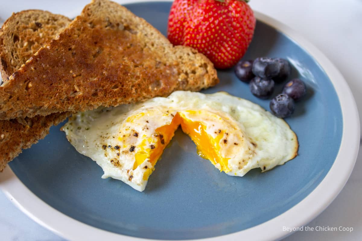 An egg cooked with the yolk still a bit runny.