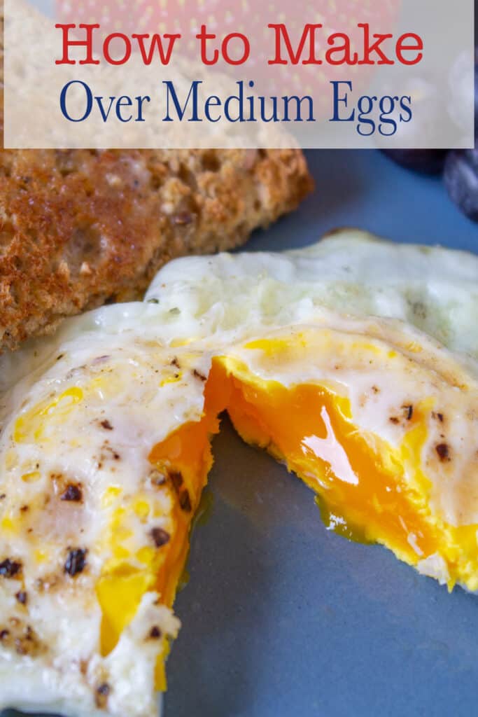 A cooked egg cut into a wedge with the runny yolk showing.