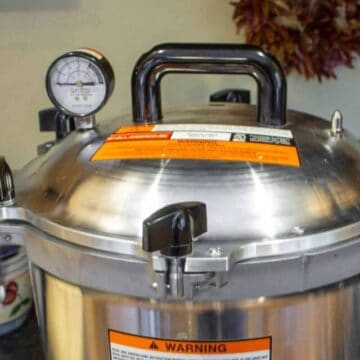 A large pressure canner on a stove.