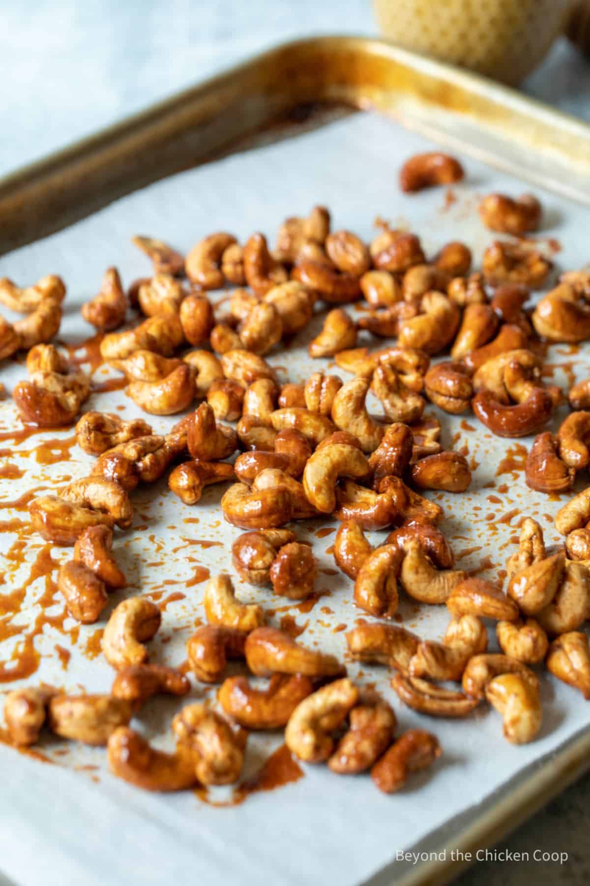 Roasted cashews on a baking sheet.