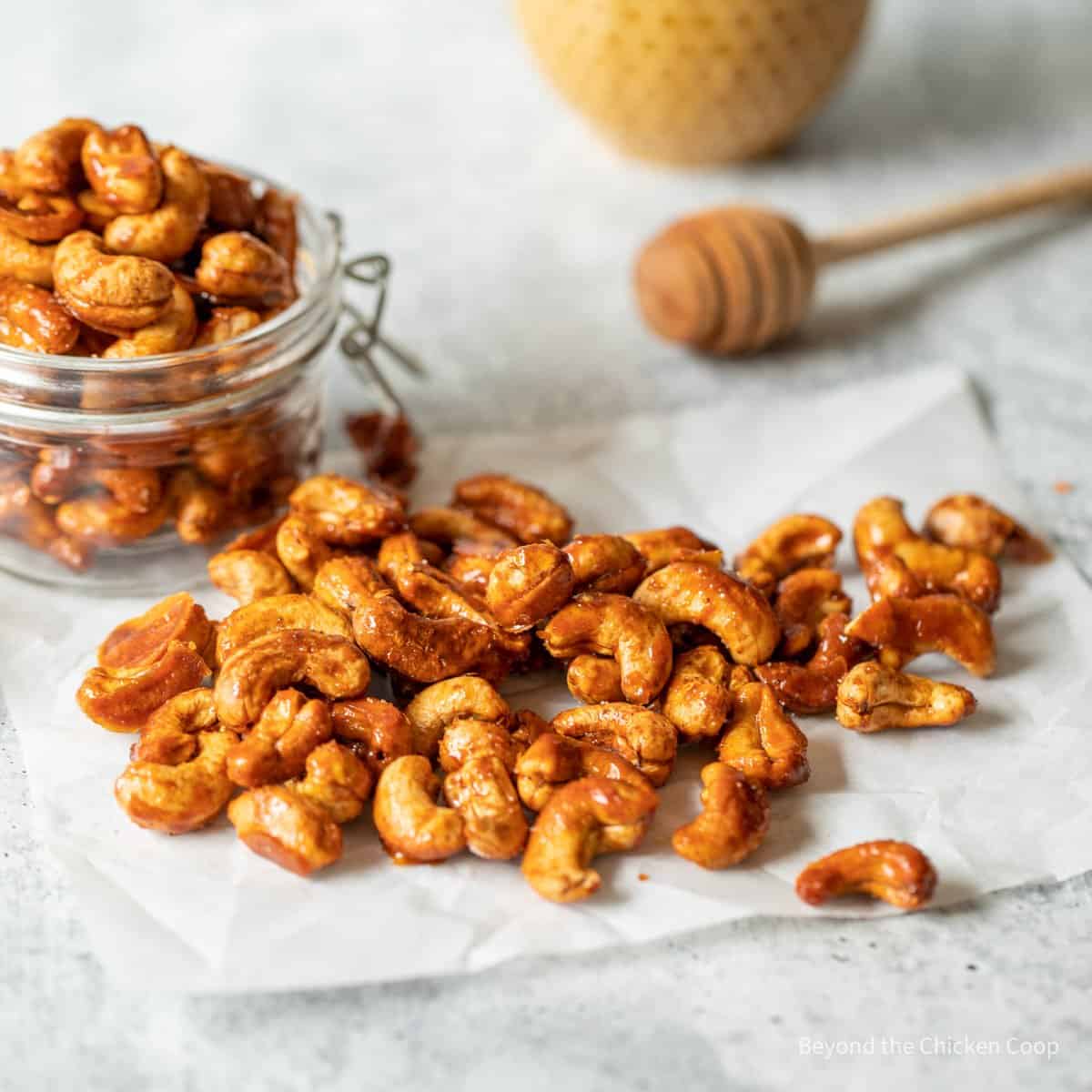 Honey Roasted Cashews on parchment paper. 