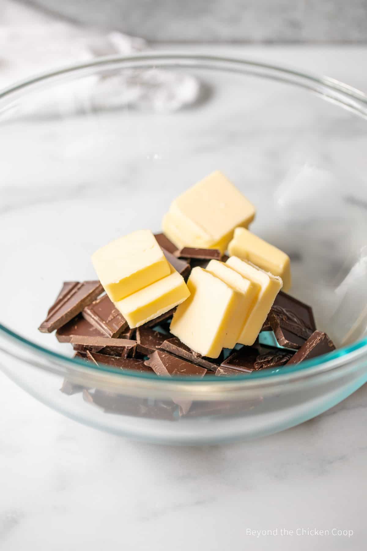 Butter and chocolate in a mixing bowl.