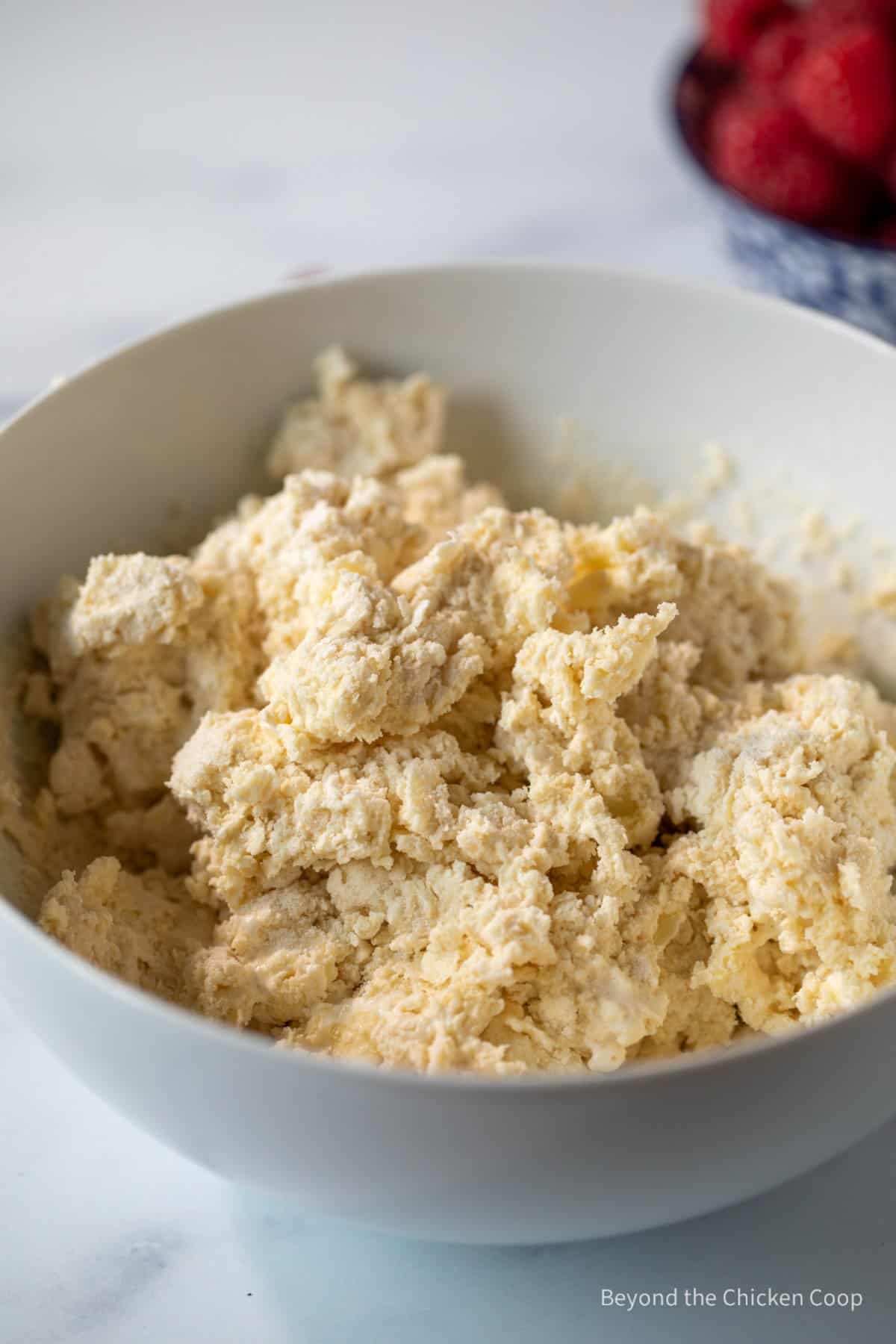 A wet biscuit dough in a bowl.