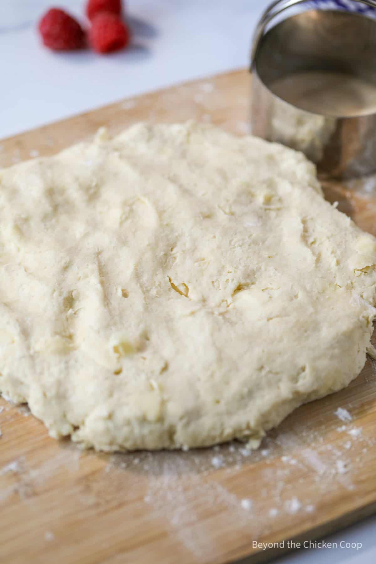 Biscuit dough on a floured board.