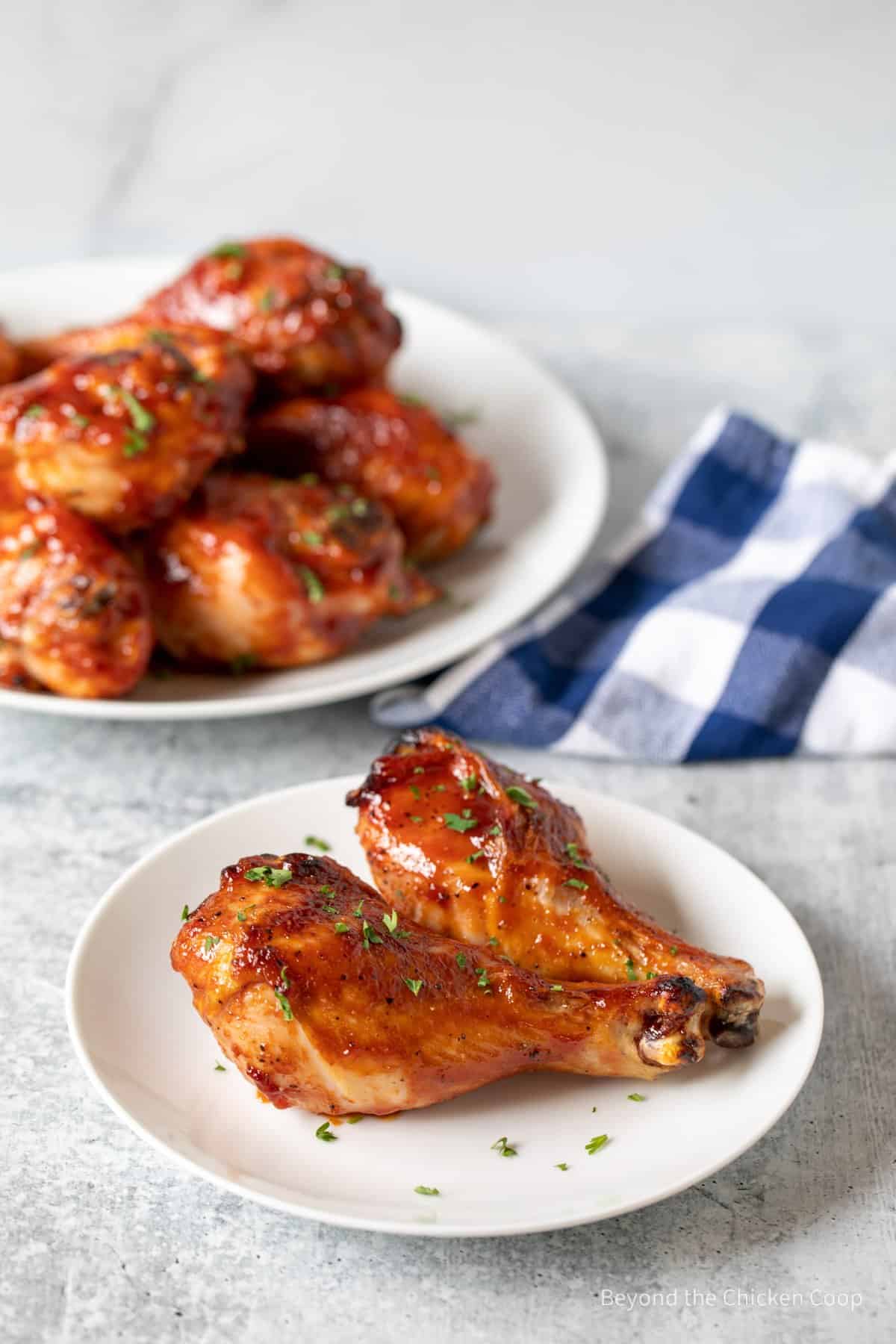 Chicken drumsticks covered with barbecue sauce.
