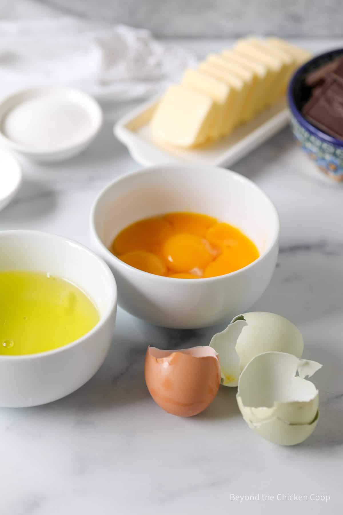 Separating eggs in bowls.
